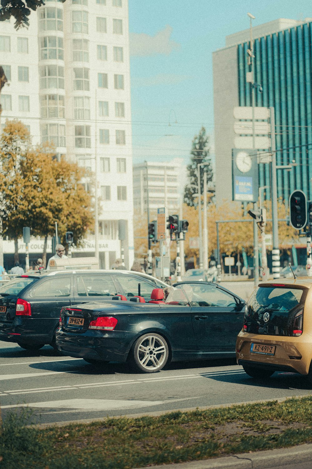 a couple of cars that are sitting in the street