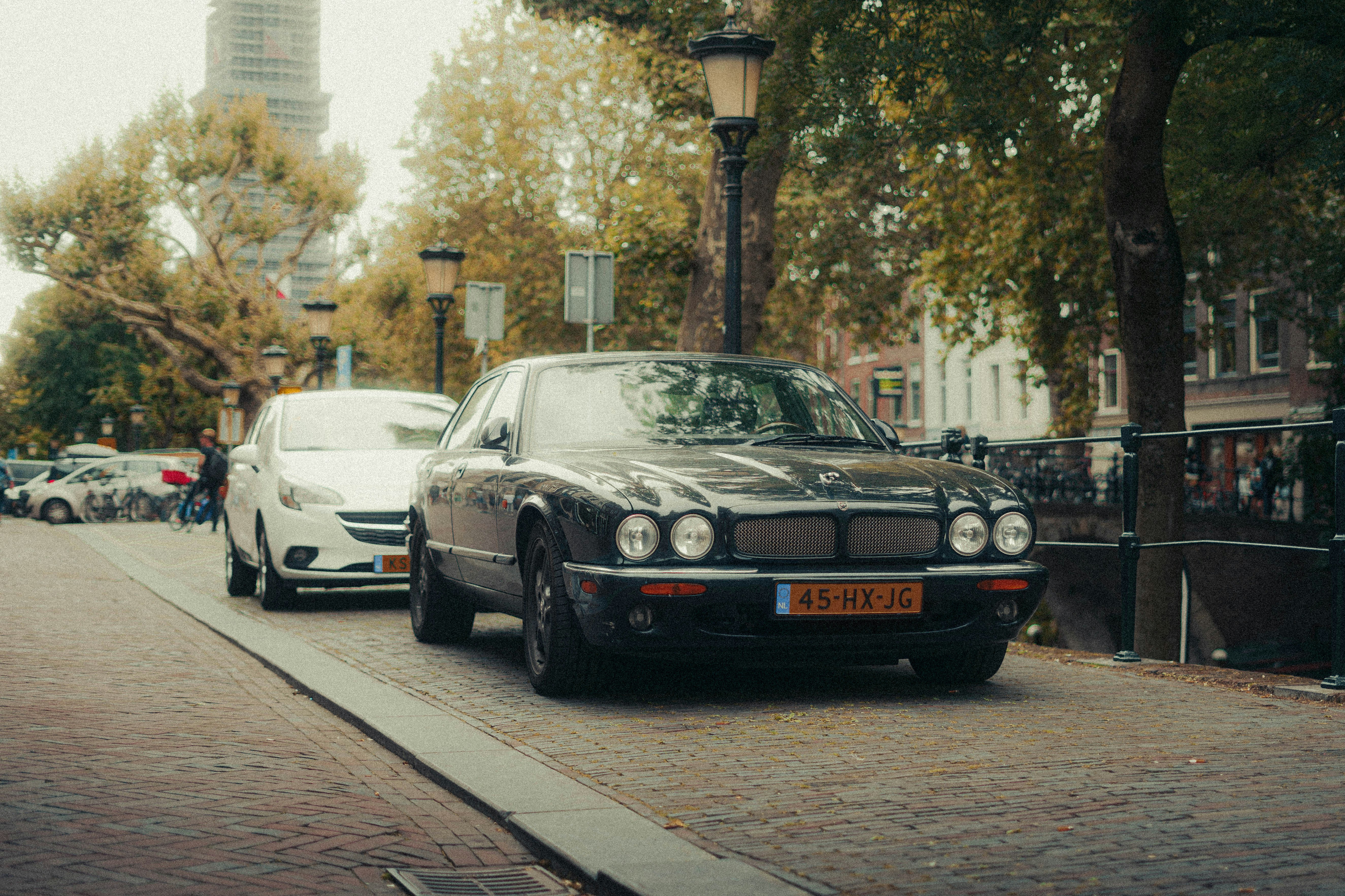 a black car parked on the side of the road