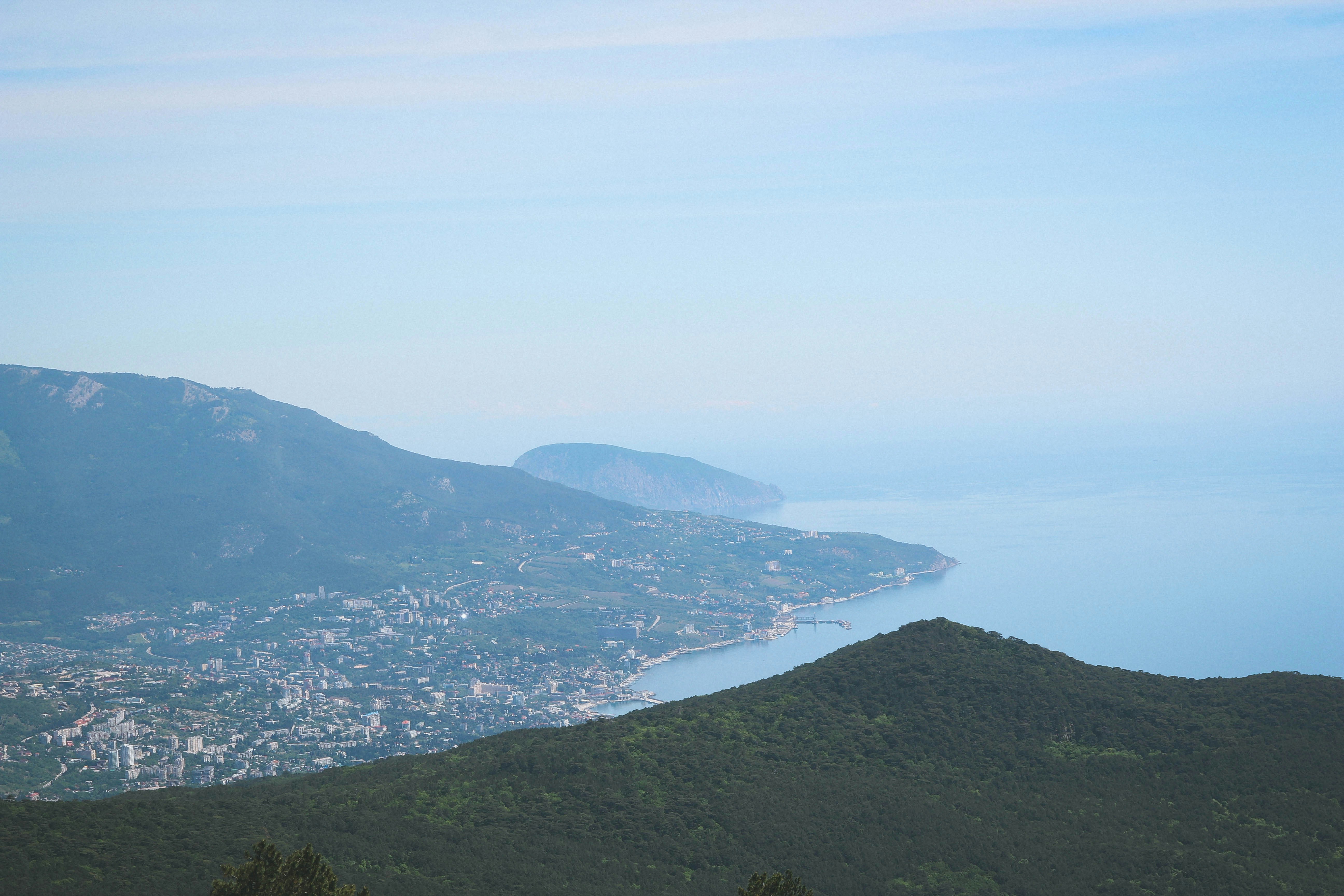 a scenic view of a city and a body of water