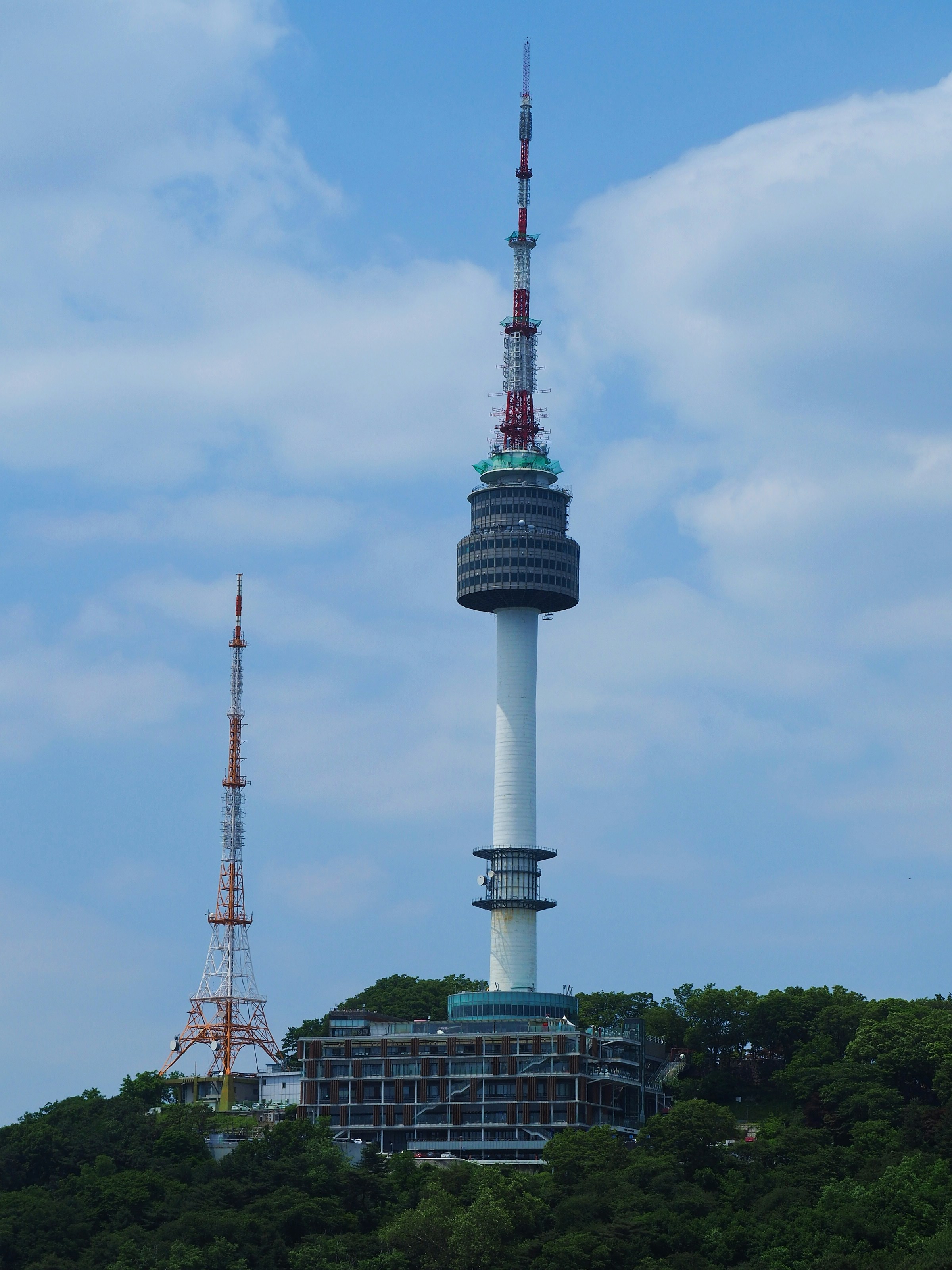 a tall tower with a sky scraper on top of it