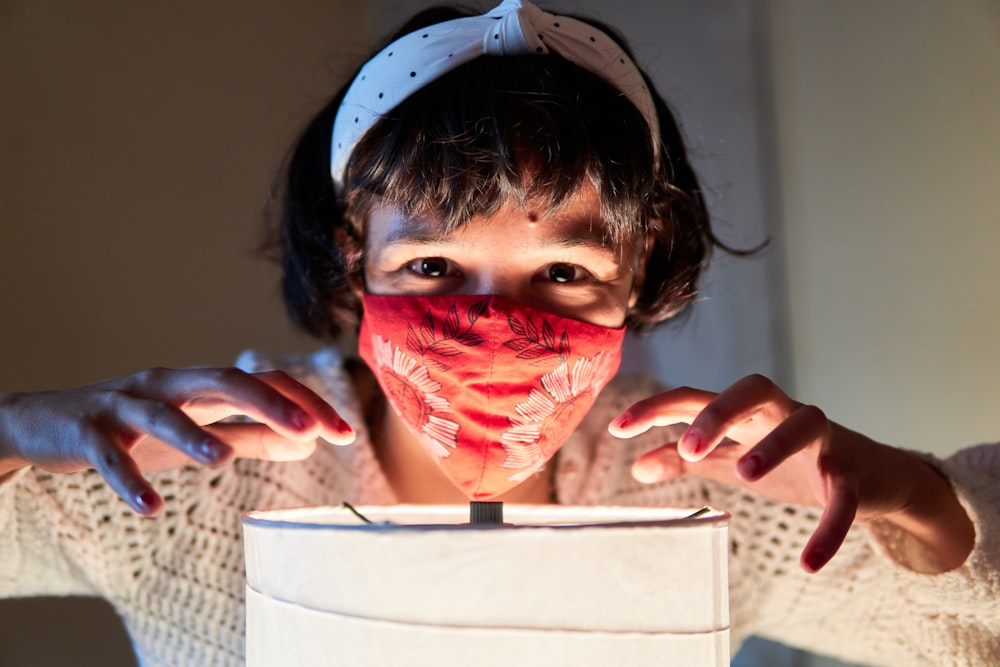 a woman with a face mask covering her face