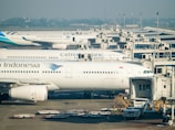 a large jetliner sitting on top of an airport tarmac