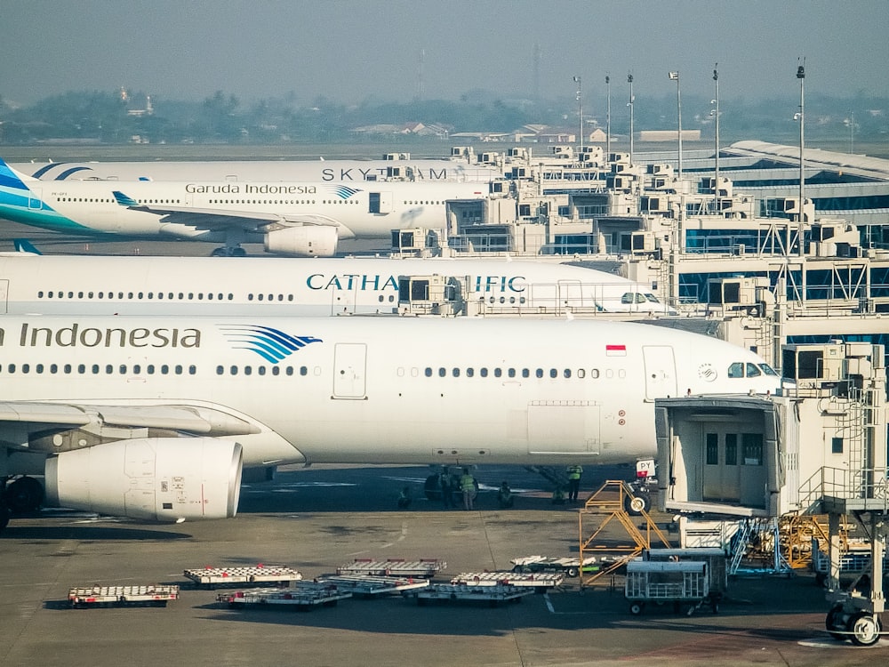 a large jetliner sitting on top of an airport tarmac