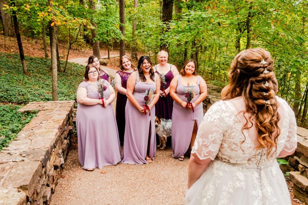 a group of women standing around each other