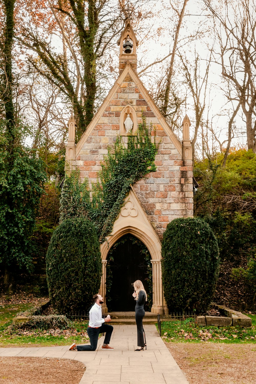 a couple of people that are standing in front of a building