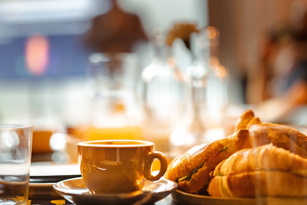 a plate of croissants and a cup of coffee