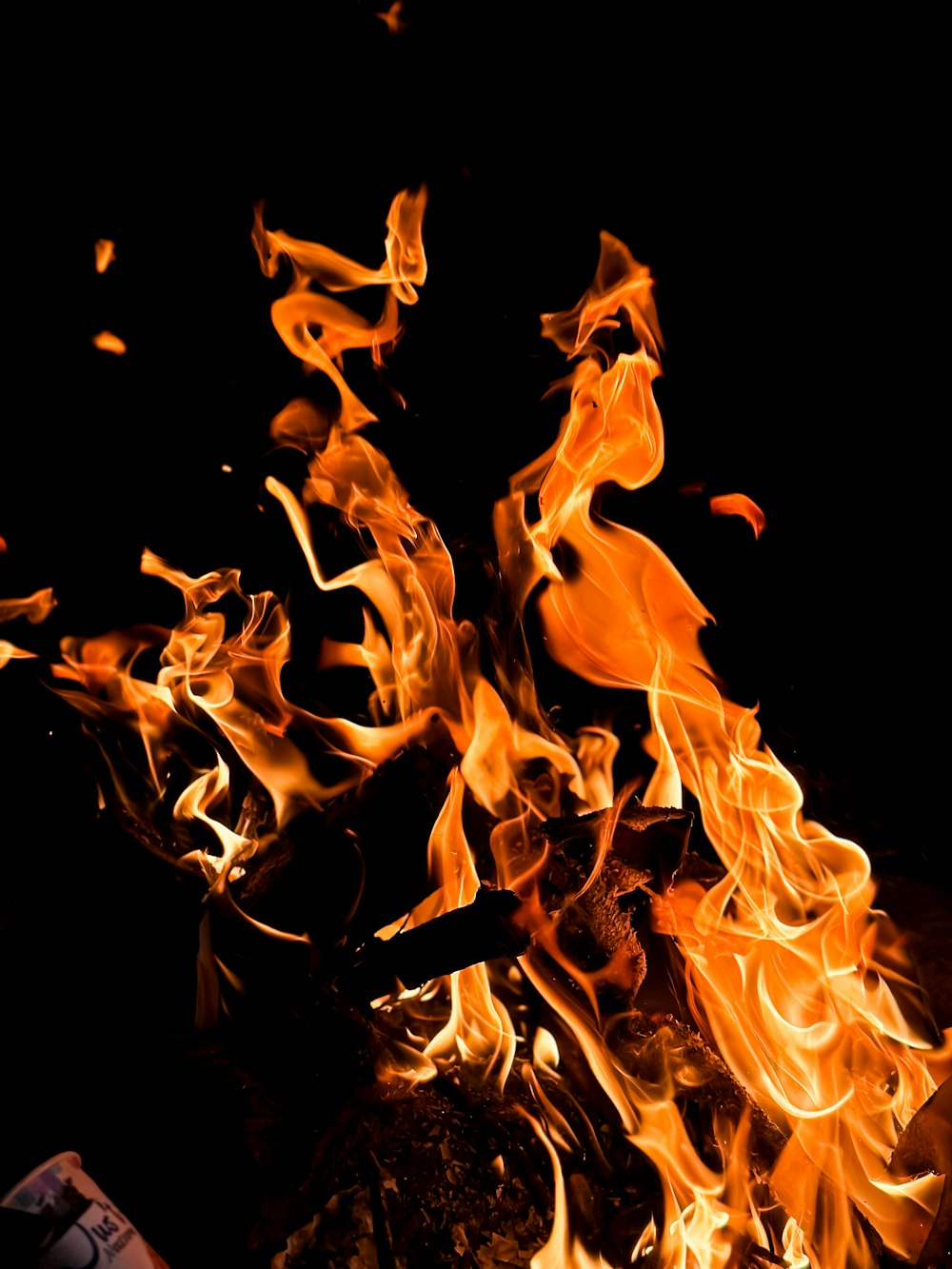 a close up of a fire in the dark