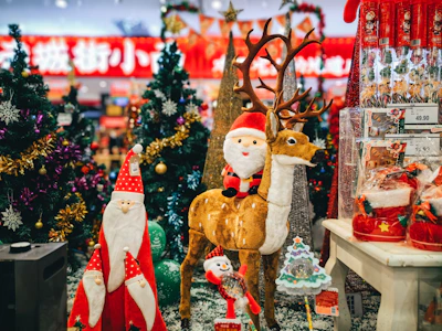 a christmas scene with santa claus and reindeer figurines