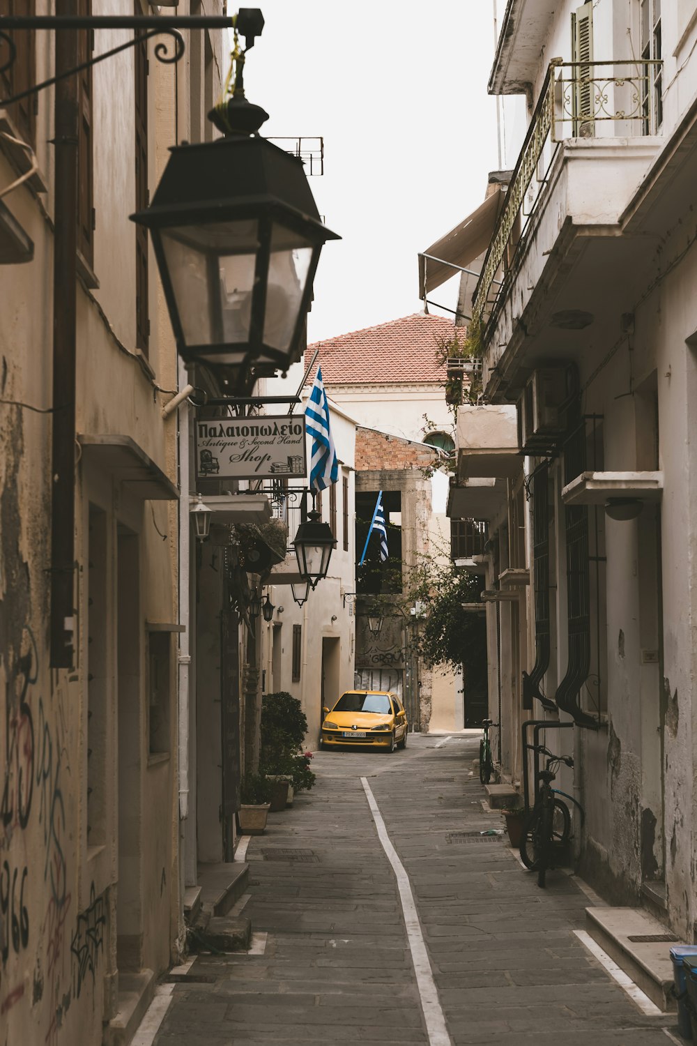 a street with a car parked on the side of it