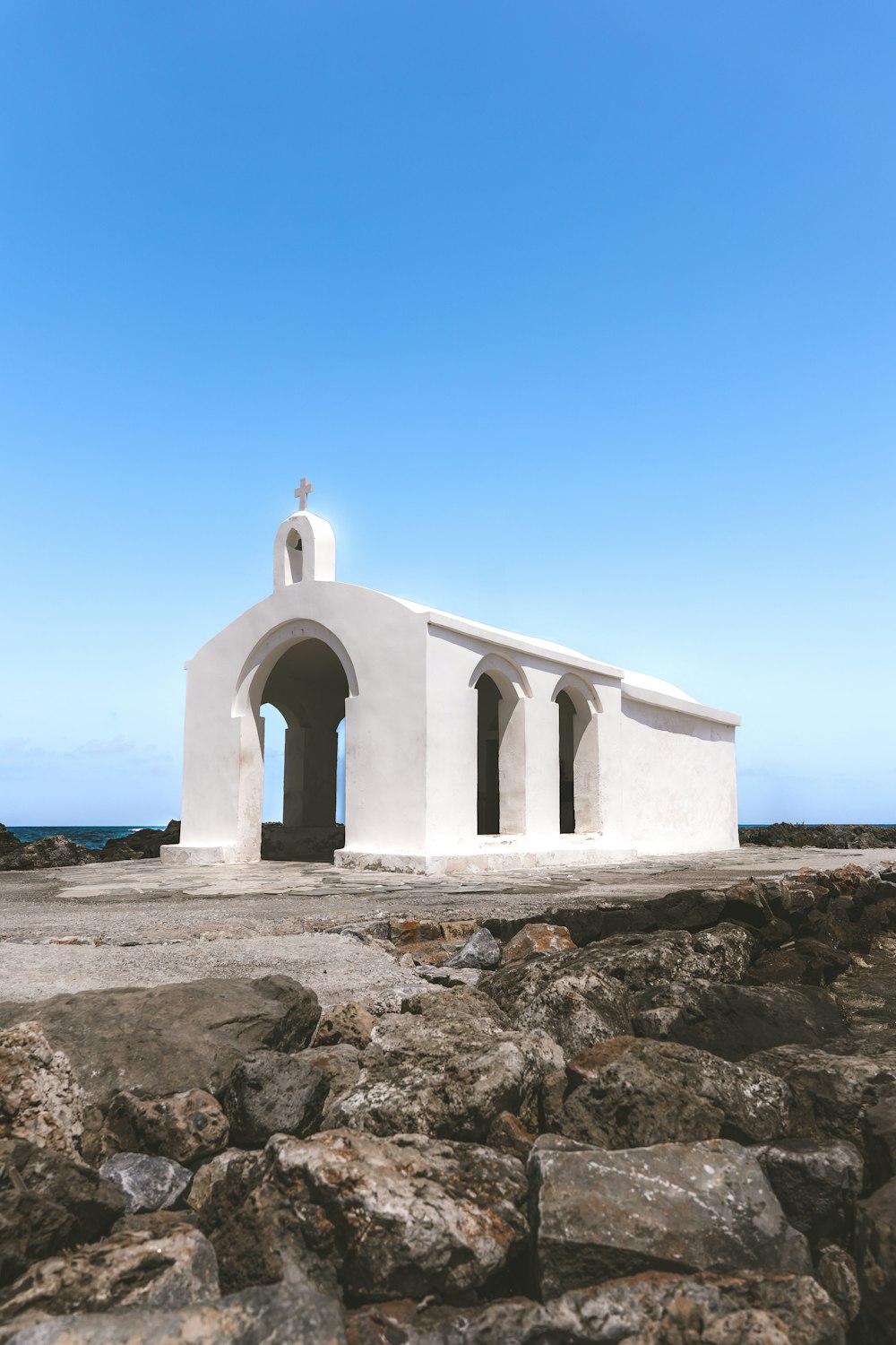 a white building with a cross on top of it