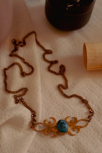 a close up of a necklace on a table