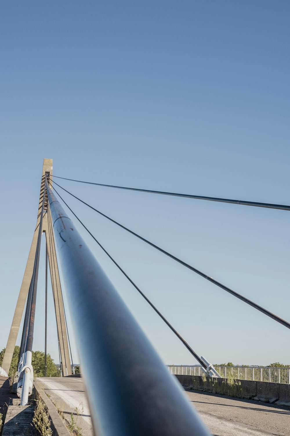 a large metal pole sitting on top of a bridge