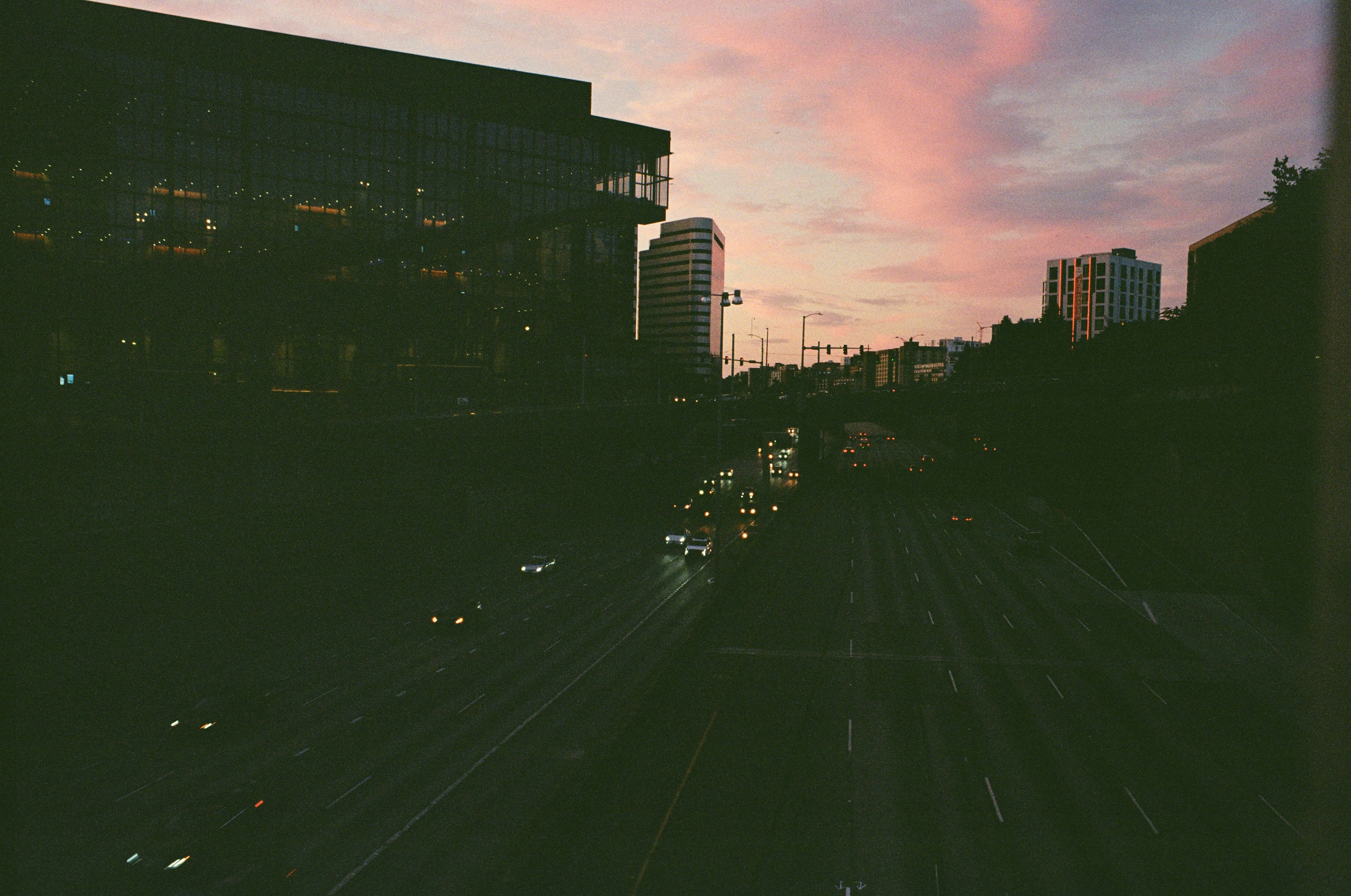 a view of a city street at dusk