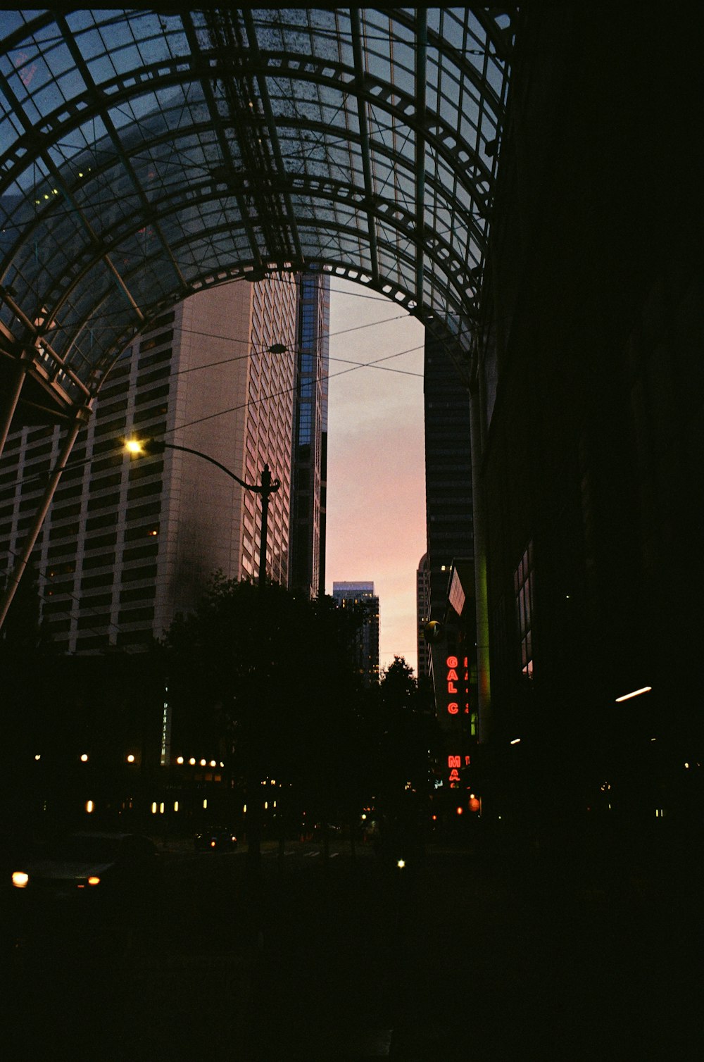 a view of a city at night from the street