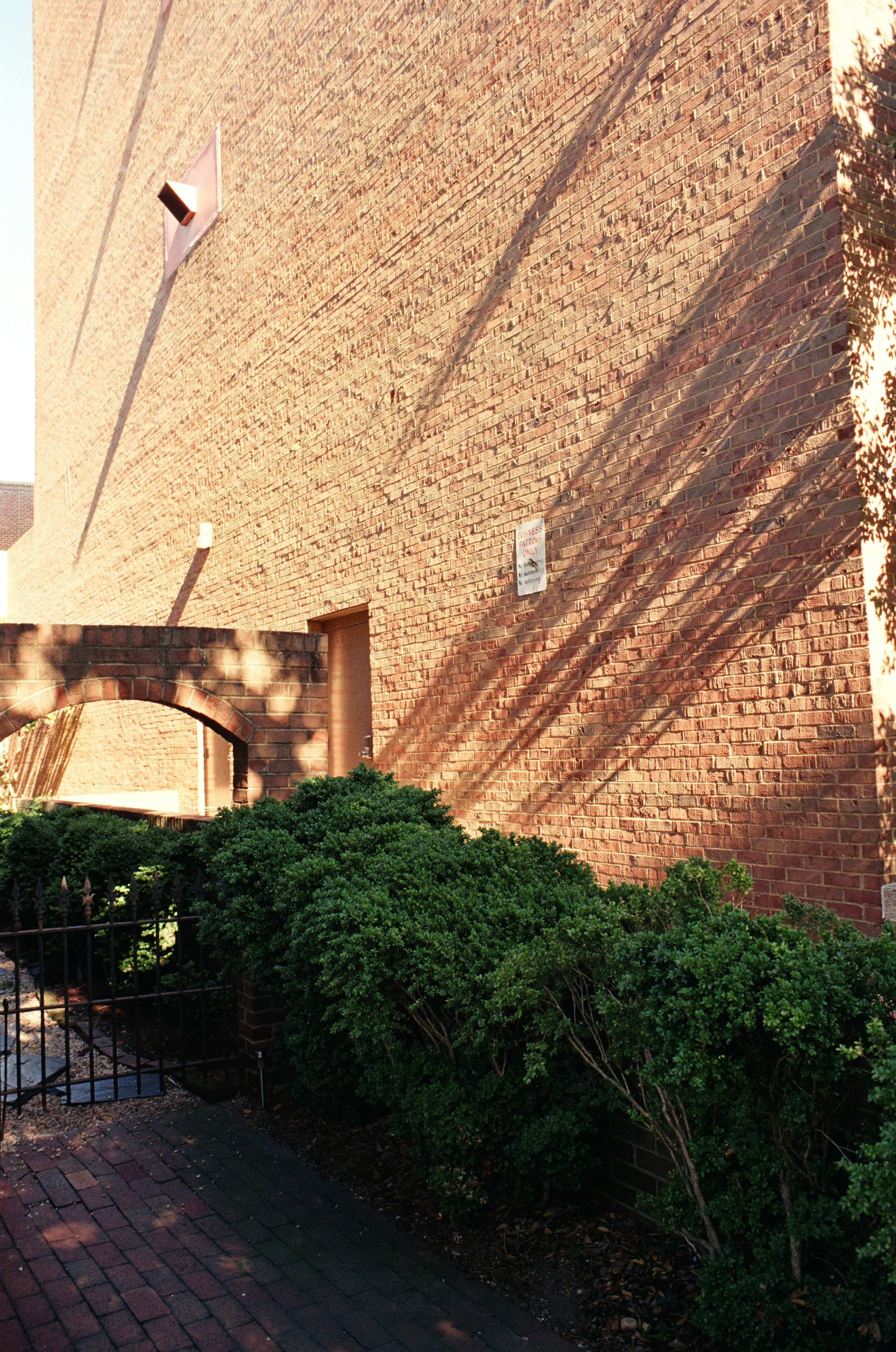 a brick building with a clock on the side of it