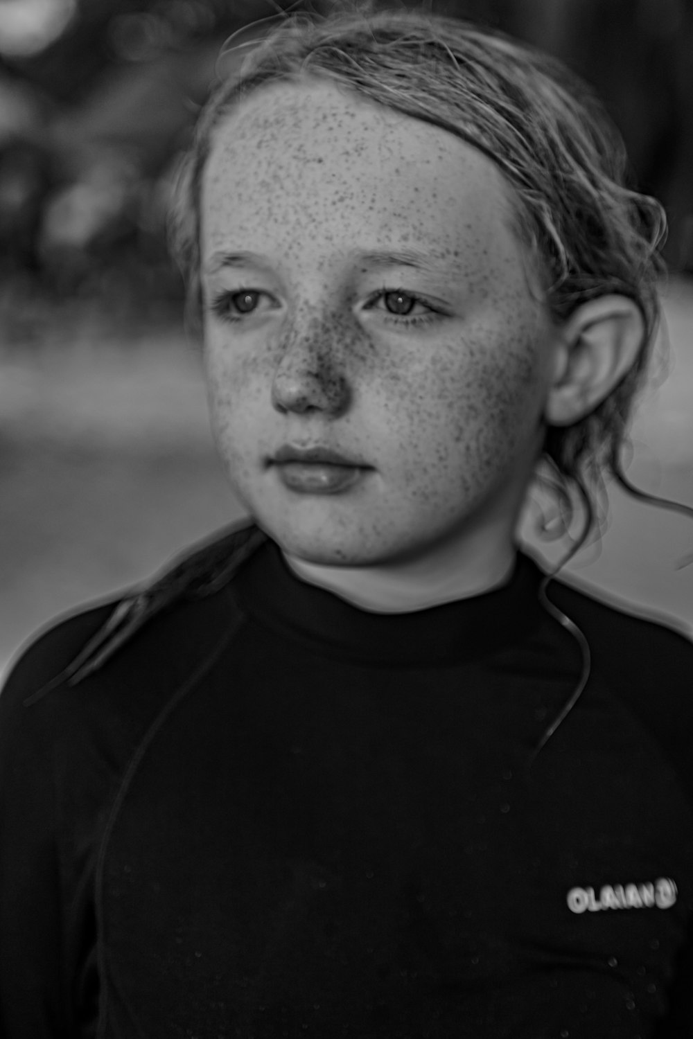 a black and white photo of a young girl