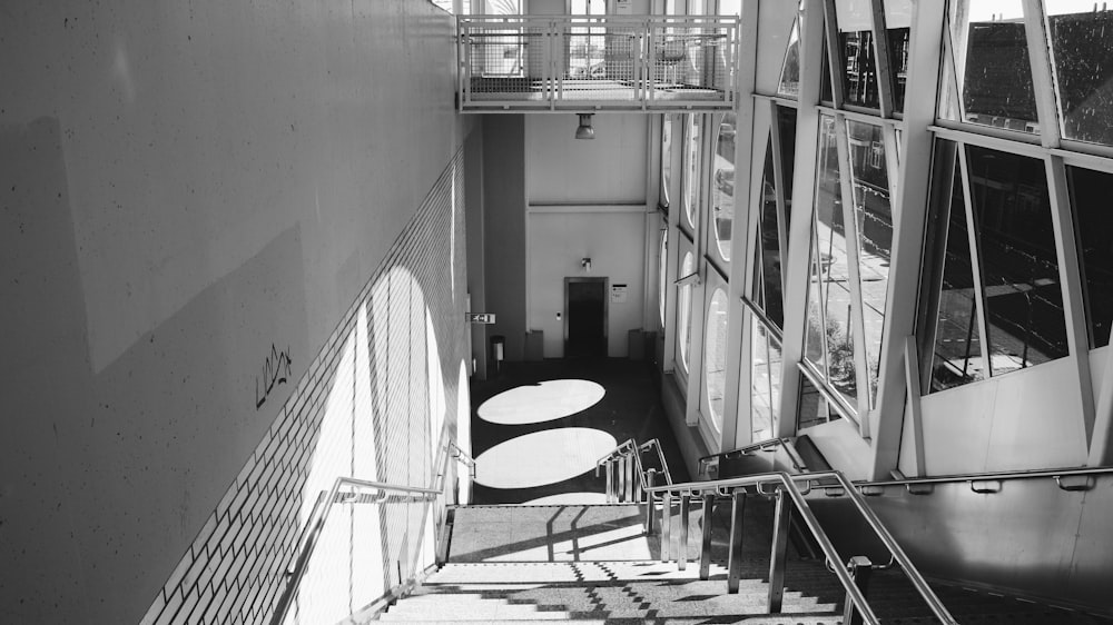 a black and white photo of a staircase in a building