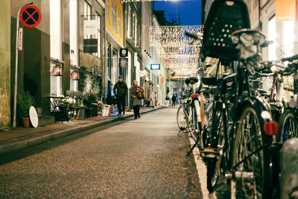 a couple of bikes parked on the side of a street