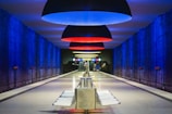 a long hallway with blue and red lights