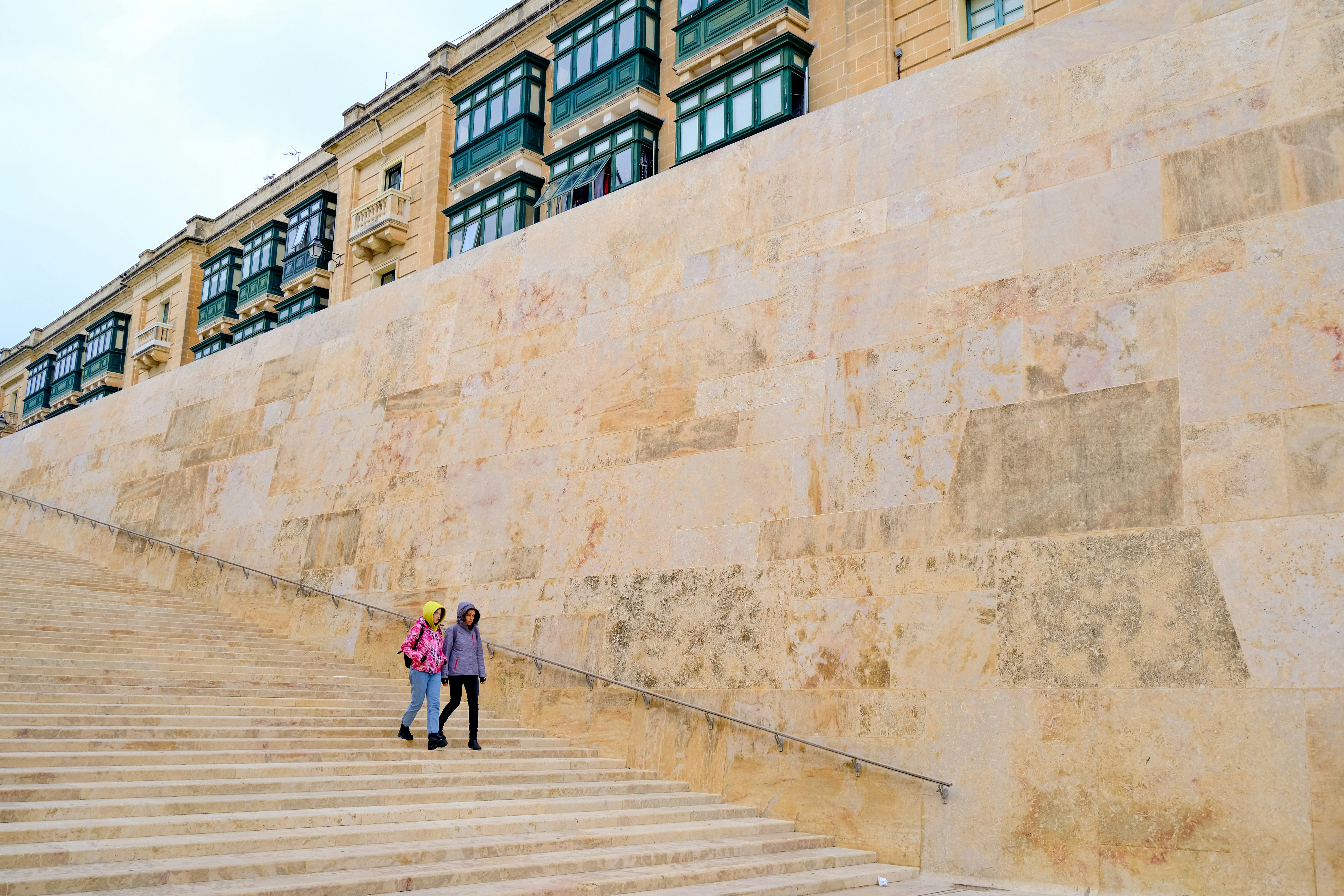 a couple of people that are standing on some steps