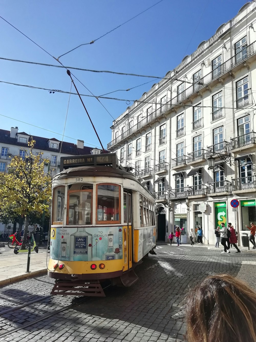 a cable car on a street in a city