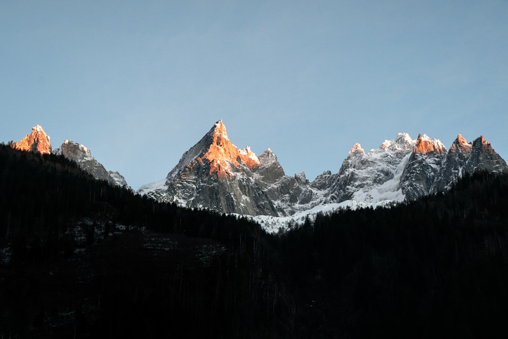 a group of mountains with snow on them