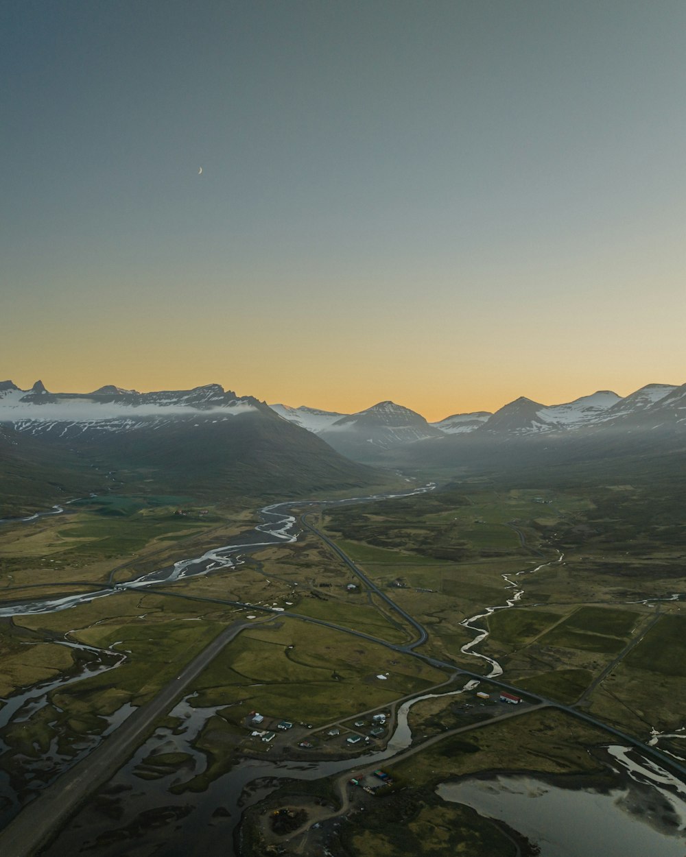 an aerial view of a mountain range with a river running through it