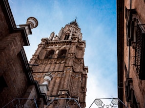 a tall tower with a clock on the top of it
