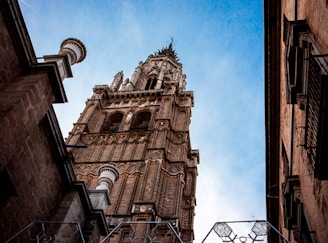 a tall tower with a clock on the top of it
