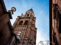 a tall tower with a clock on the top of it