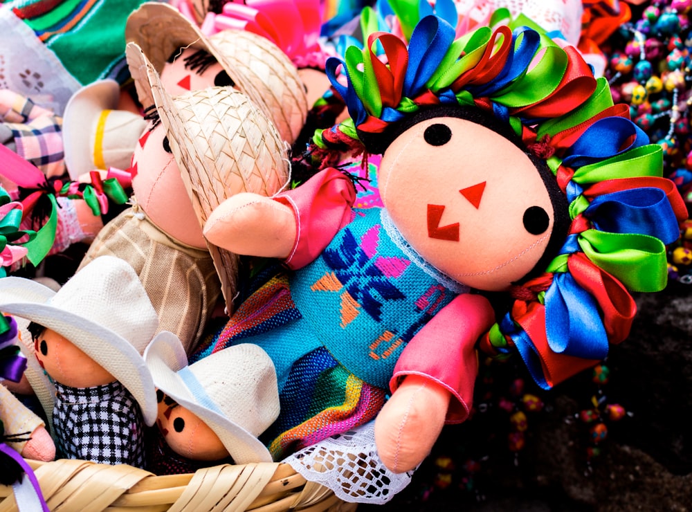 a basket filled with lots of stuffed toys