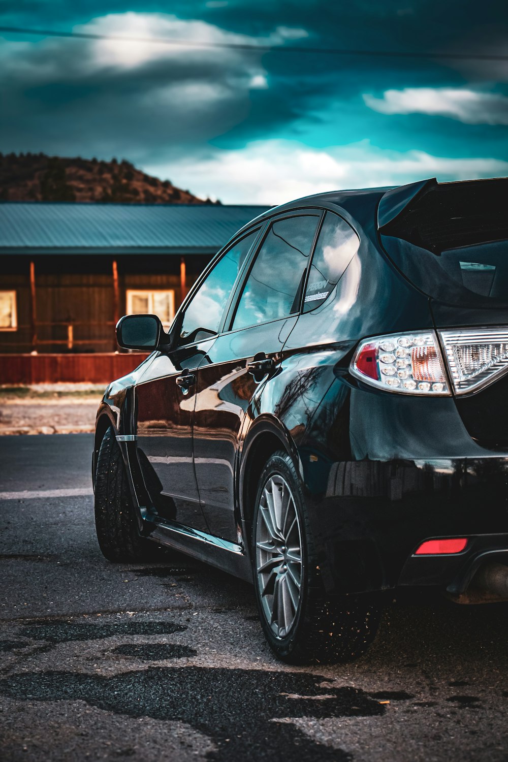 a black car parked in a parking lot