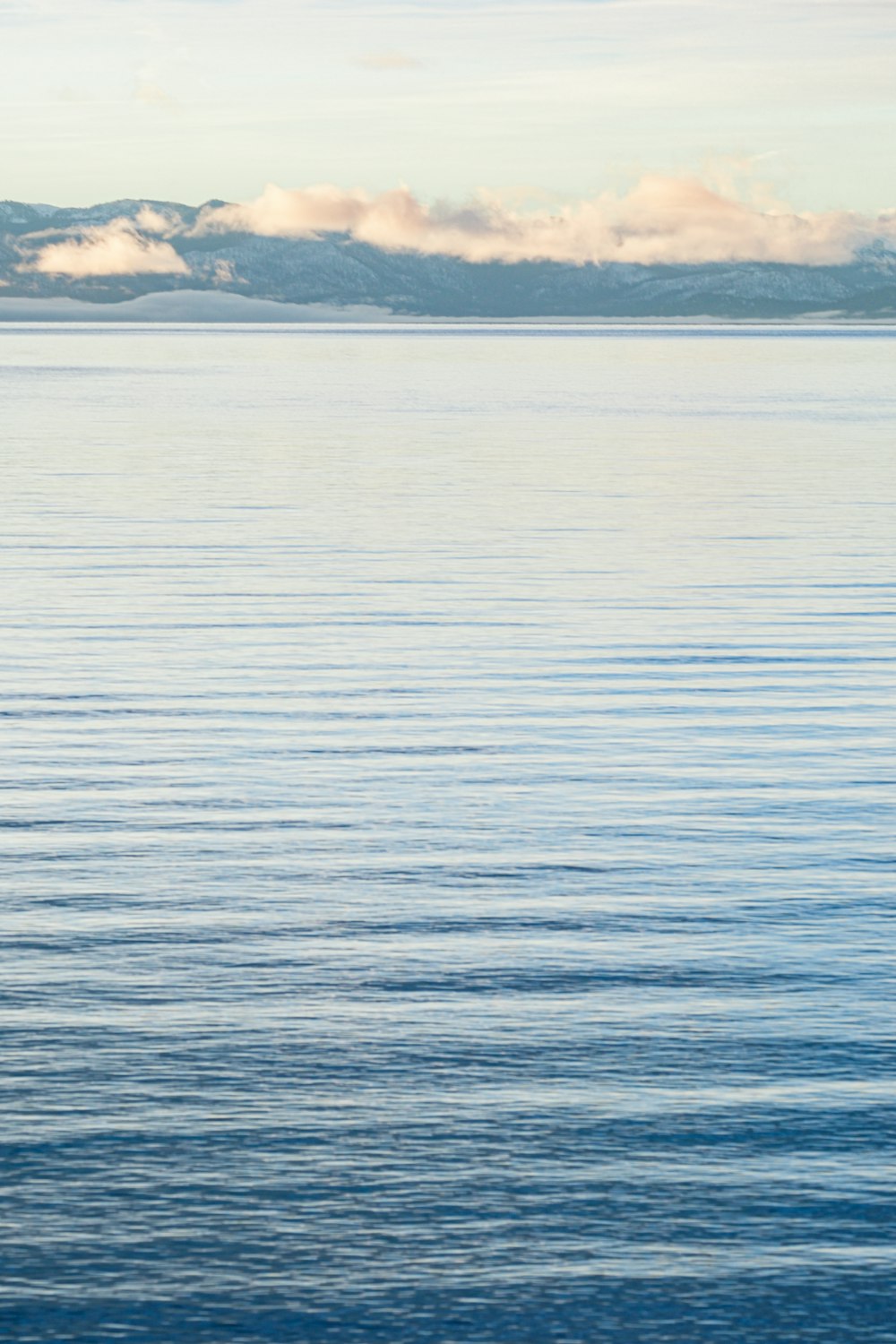 a boat floating on top of a large body of water