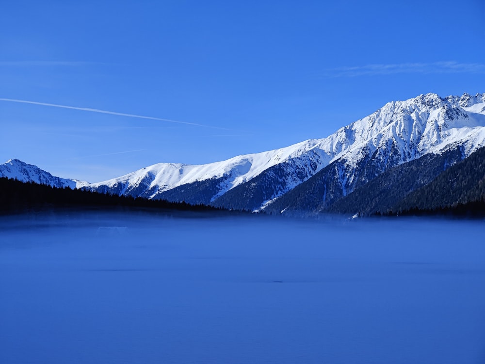 a view of a snowy mountain range in the distance