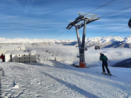 a man riding skis down a snow covered slope in Davos