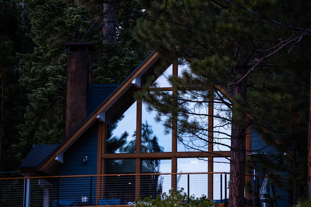 a house in the woods is lit up at night