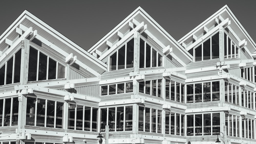 a black and white photo of a building with many windows