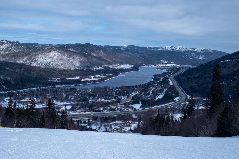 a person standing on top of a snow covered slope