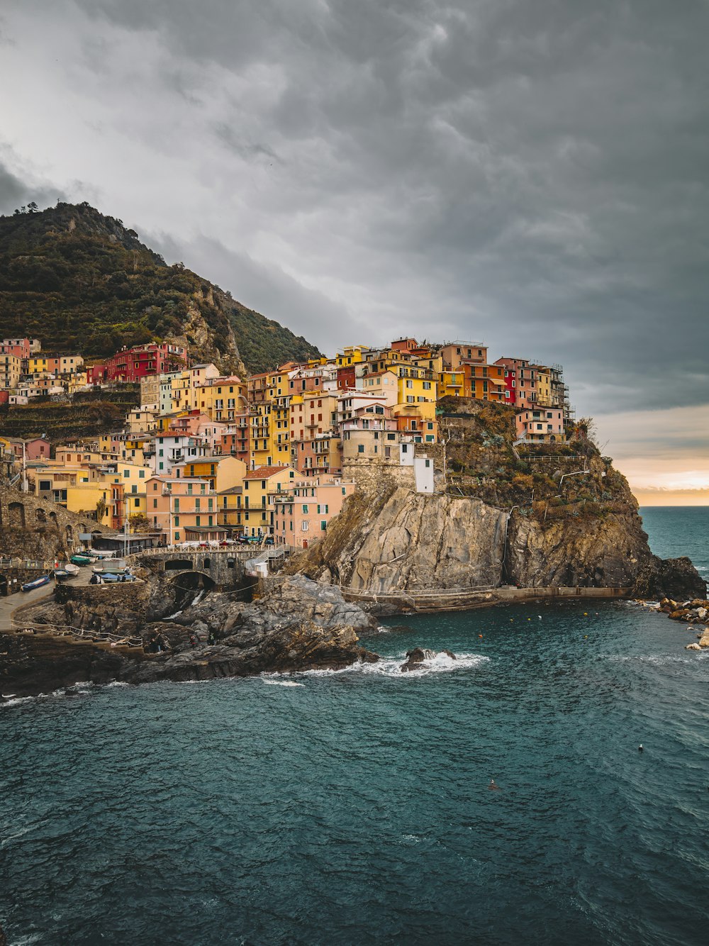 a village on a cliff overlooking the ocean