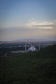 a view of a city from the top of a hill