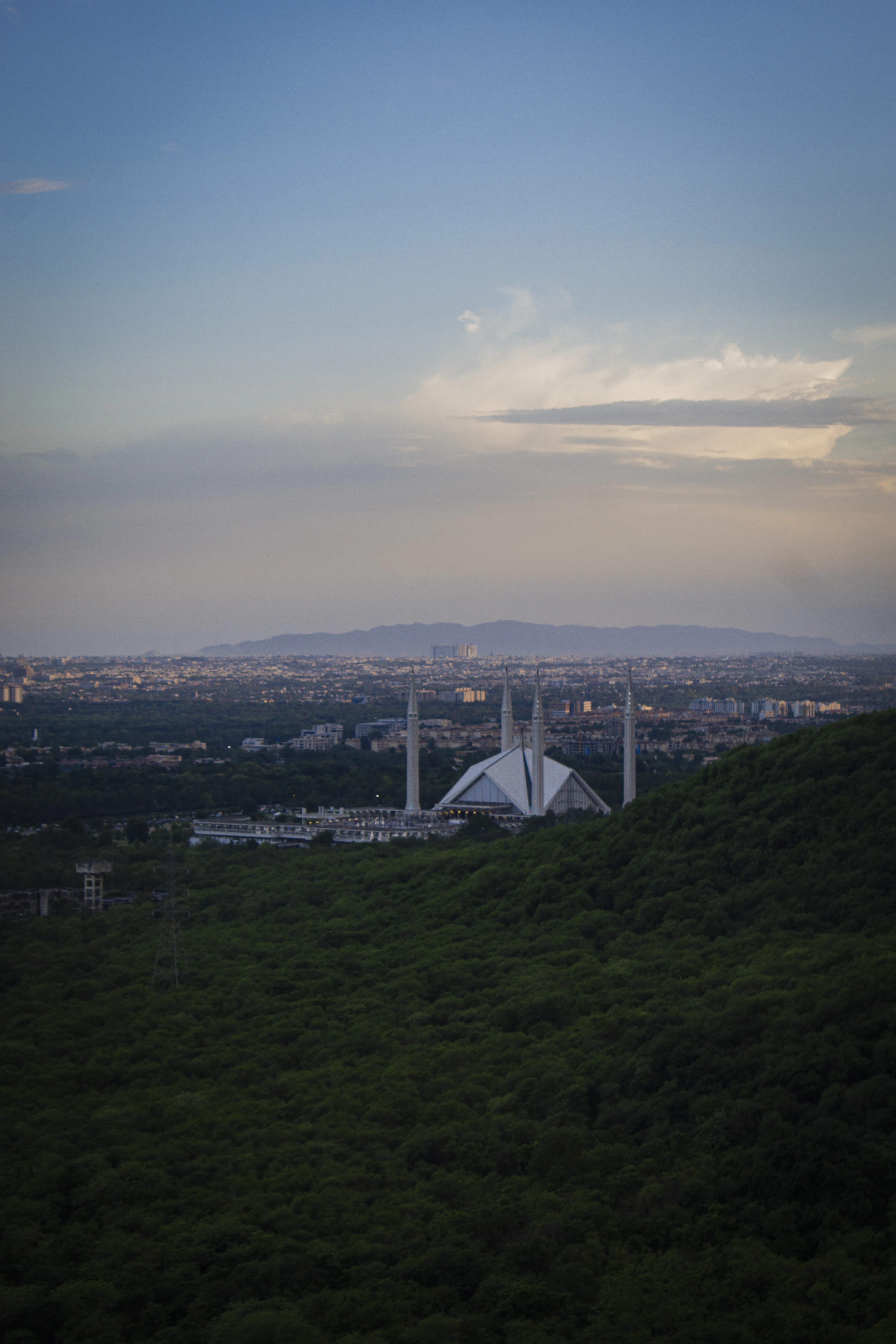 Islamabad at dusk with the Faisal Mosque in the distance