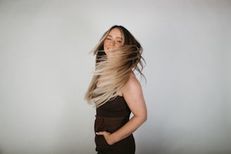 a woman with her hair blowing in the wind
