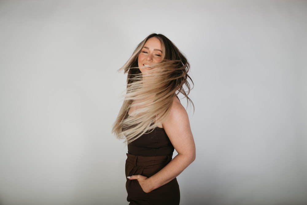 a woman with her hair blowing in the wind