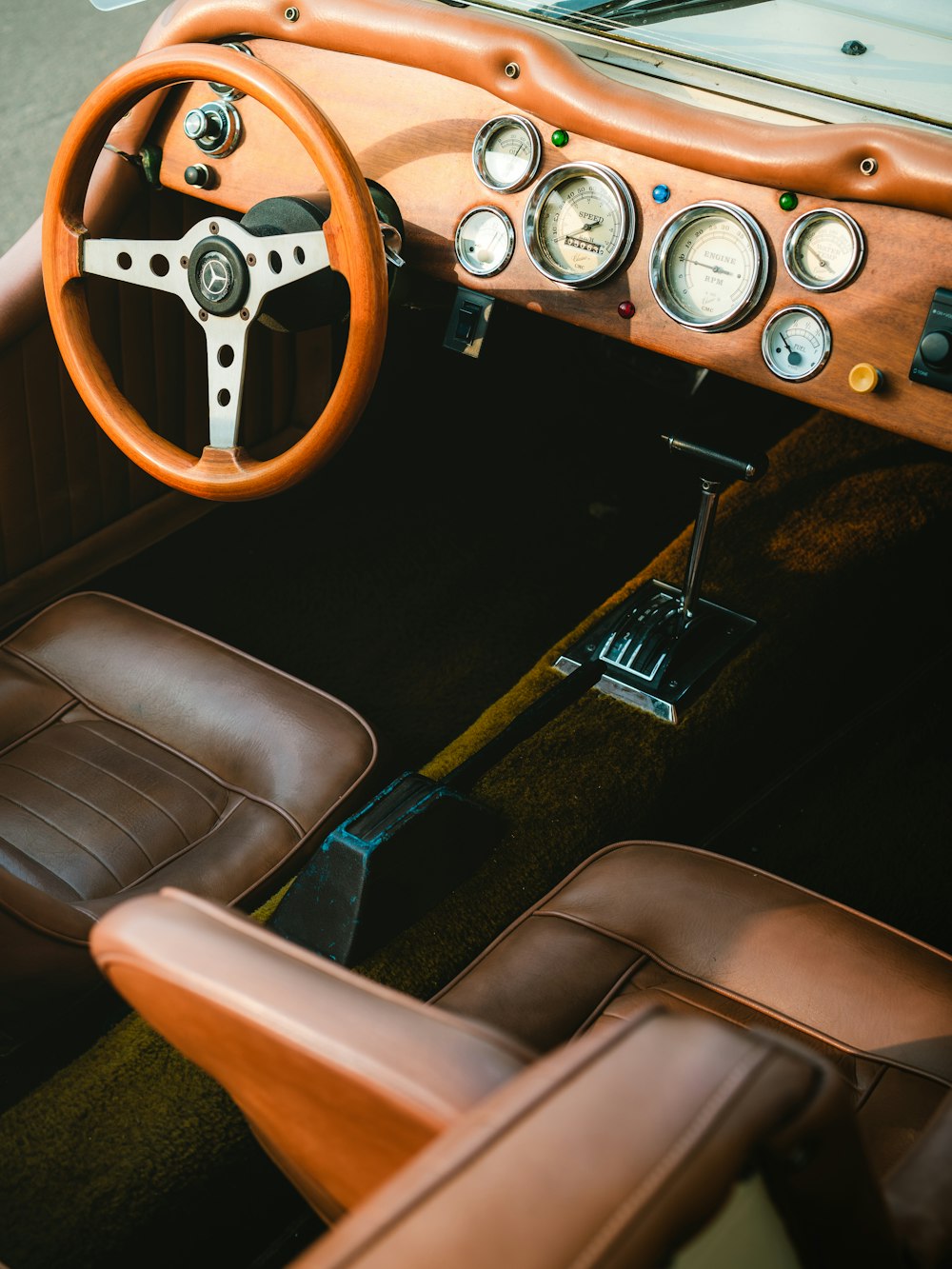 the interior of a car with a steering wheel and dashboard