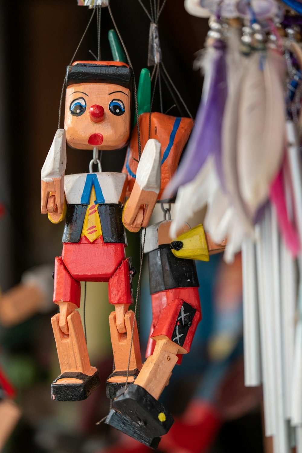 a wooden toy hanging from a string