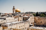 a view of the old city of jerusalem, with the dome of the rock in