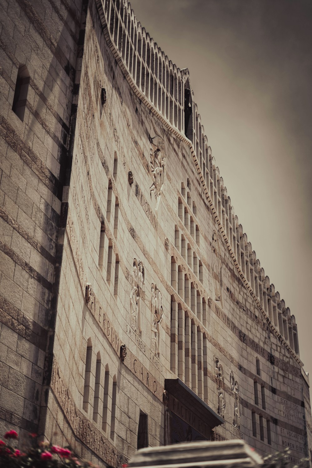 a very tall building with a clock on it's side