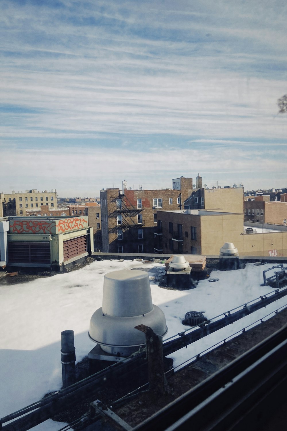 a view of a city from a roof of a building