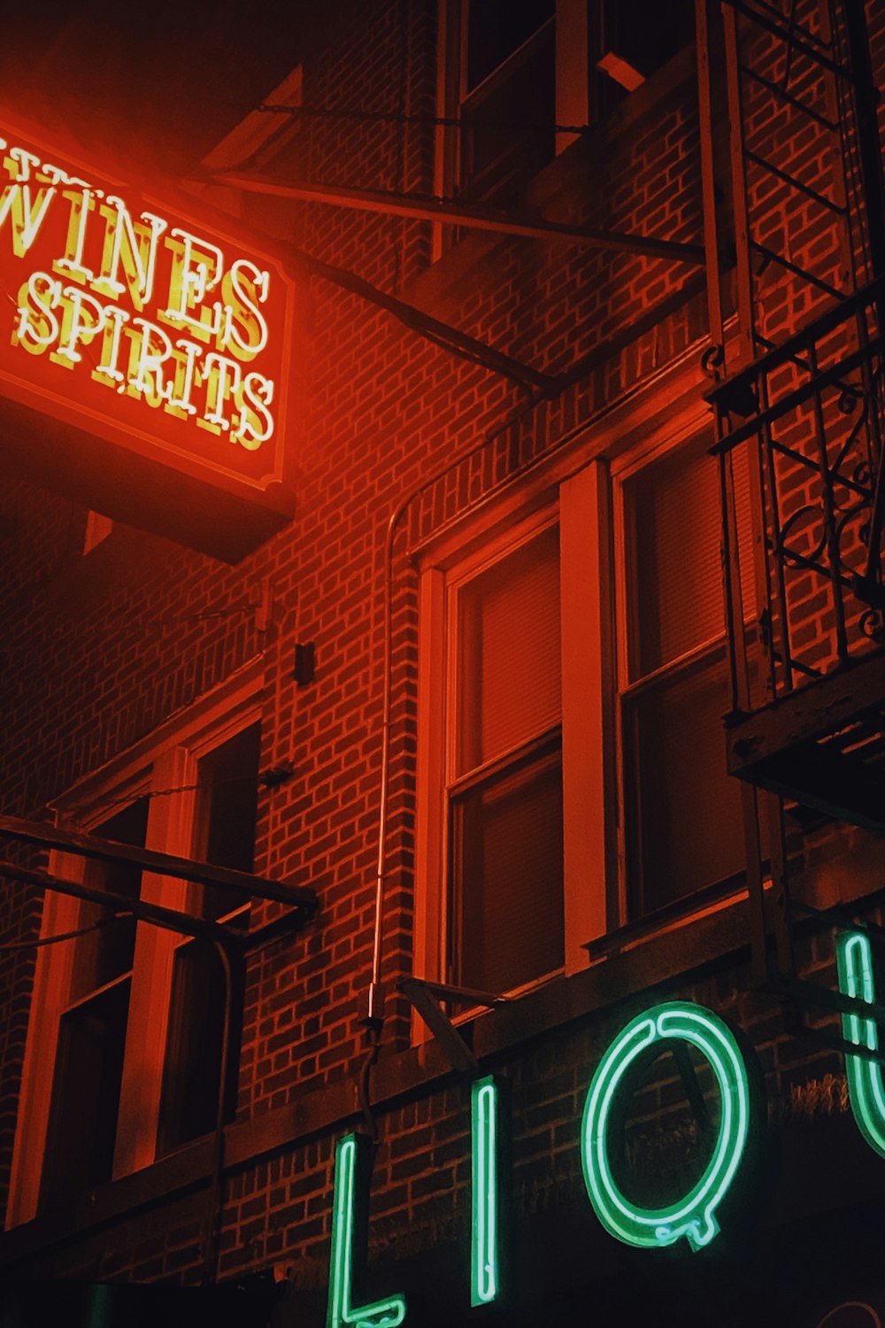 a neon sign on the side of a building