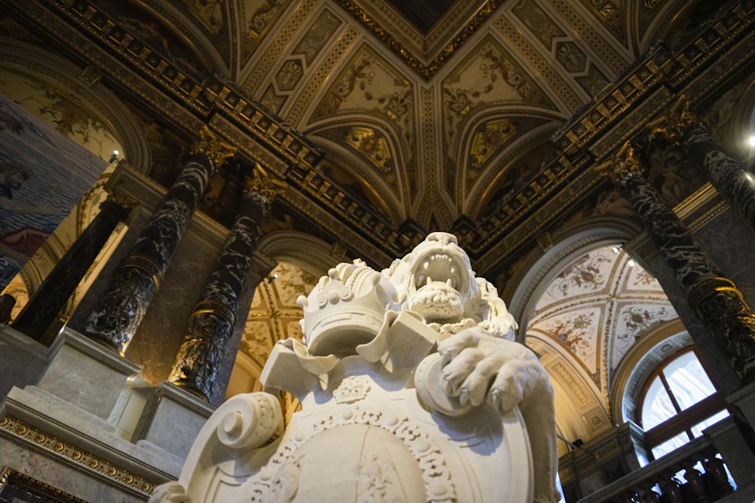 a large white statue in a large building,